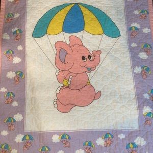 That’s our baby, pink elephant quilt, crib blanket. Back is polka dots!